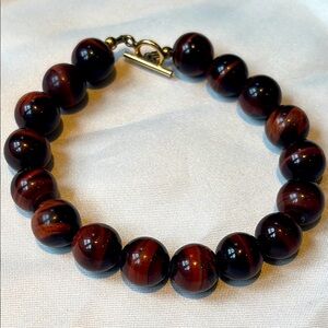Brown bracelet: tigers eye OR a lovely glass imitation - aka marbles.